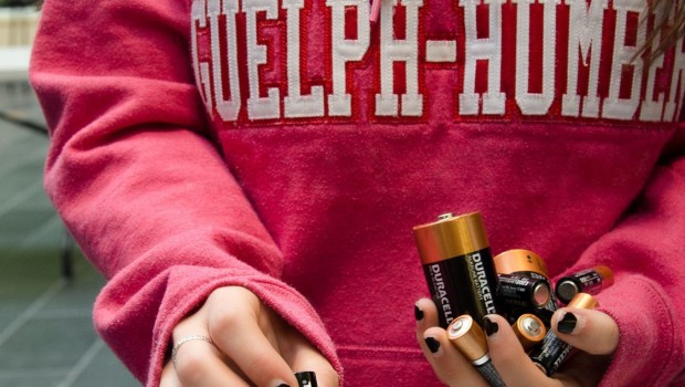 Student holing batteries at battery drive